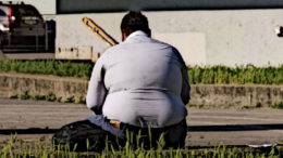 An overweight homeless man.