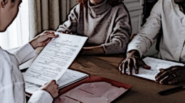 A social worker looking at a verification letter.
