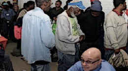 Homeless people in line at a job fair.