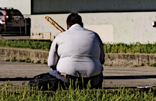 An overweight homeless man.
