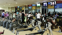 People exercise in a fitness gym.
